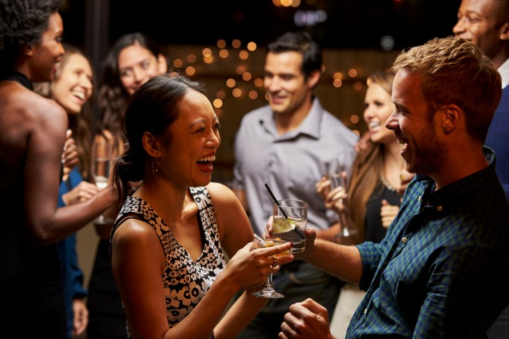 couples dancing, smiling and drinking